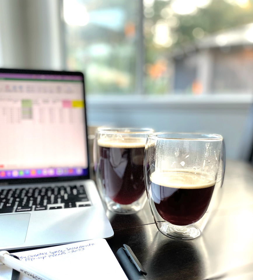 We really like coffee, and we know you do too. So we taste test again, and again. This is a picture of multiple cups of coffee and a laptop.